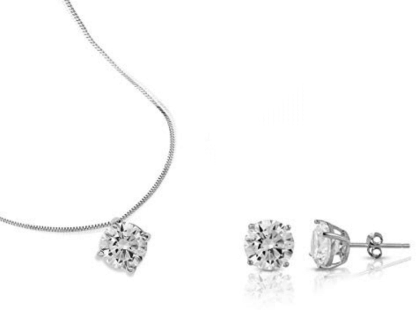 complete set in 18k white gold with light point pendant and earrings and 3 natural diamonds 1.35 ct color E VVS1